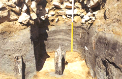 Current condition of the lumber and muddy layer below the stonework image