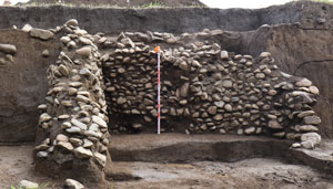 Pit-style stone-lined storage (presumed ice storage)