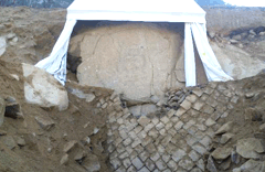 The frontal side of the stone column of the Seated Buddha Carved on Rock Cliff image